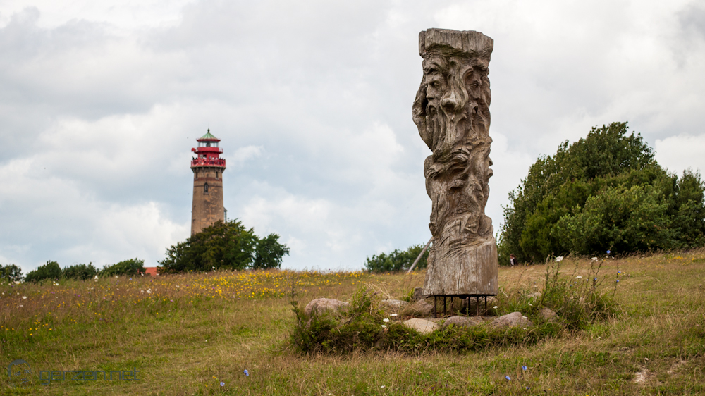 An idol and lighthouse shares the island